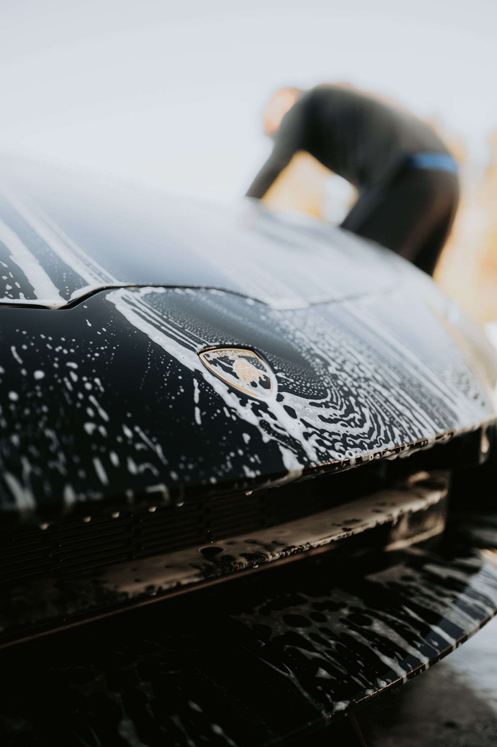 Sports car under thick soap suds